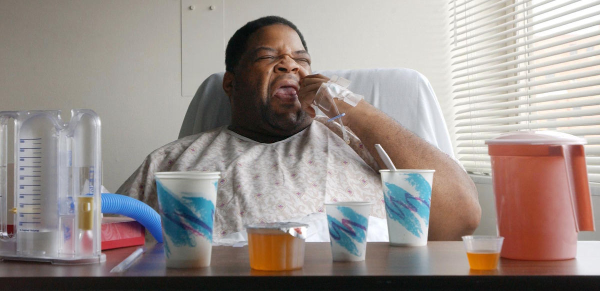 First Place, Photographer of the Year - John Kuntz / The Plain DealerChip grimaces as he downs some medicine that tasted horrible in his room a day after undergoing bariatric surgery at St. Vincent Charity hospital.