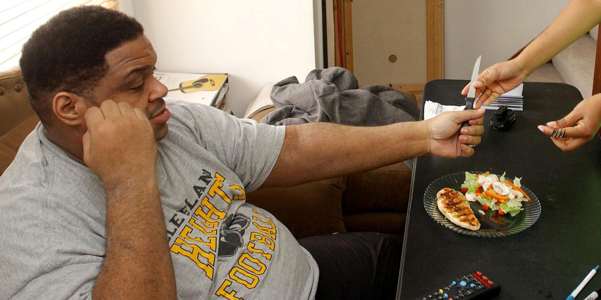 First Place, Photographer of the Year - John Kuntz / The Plain DealerChip is not over thrilled at the portion size of his dinner but after his bariatric surgery he is feeling full after the portion at his home in Cleveland.