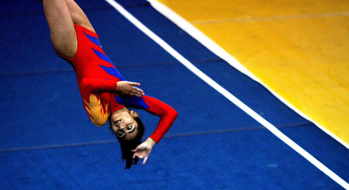 Second Place, Photographer of the Year - Mike Levy / The Plain DealerAnna Yeghian from Armenia competes in the floor exercise at John Carroll University in University Heights while competing in the International Children's Games.  