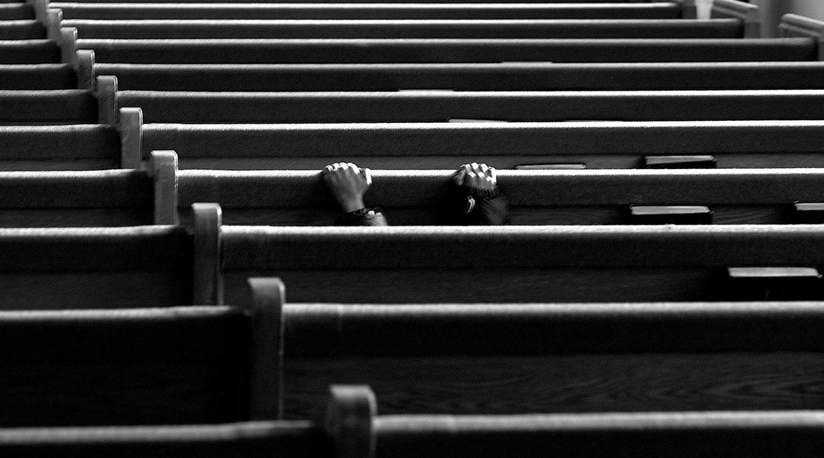 Second Place, Photographer of the Year - Mike Levy / The Plain DealerPrayer after service at Mt. Haven Baptist Church.