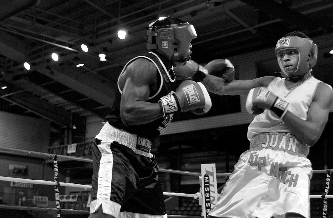 Second Place, Photographer of the Year - Mike Levy / The Plain DealerThere was no crowd at McPherson's early fight.  He was competing against a boxer he had beaten twice before.  No one expected what happened next.