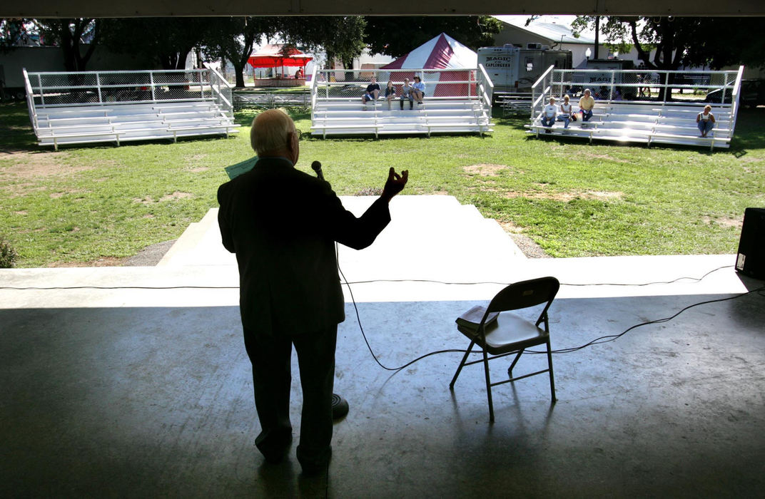 Award of Excellence, Photographer of the Year - Fred Squillante / The Columbus DispatchEvangelist Paul Pratt preaches about truth to an audience of eight at a Sunday morning service at the Ross County Fair near Chillicothe. The service goes on no matter the number of worshippers. 