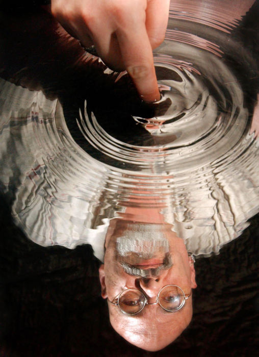 First Place, Photographer of the Year - John Kuntz / The Plain DealerPortrait of Ken Maye of Akron with the ripples created in a pool of water where he is reflected May 11, 2004.  Ken Maye was part of the Living Waters program at St Lukes where he spiritually dealt with his bisexuality through the healing power of Jesus Christ.   Ken is now married with two children and is a music worship leader at his church.