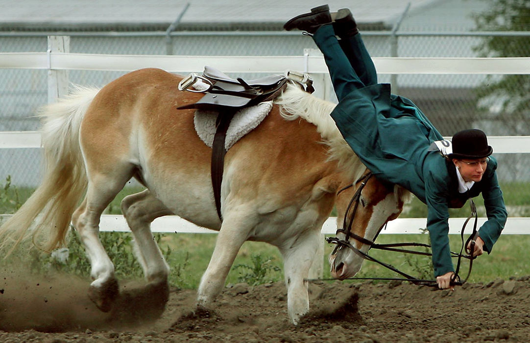 Third Place, Sports Action -  Lisa Dutton / The BladeMarie Myers of Notre Dame Academy is thrown from her horse during a high school equestrian event.  After a quick check from paramedics she was back in the saddle to finish her event.