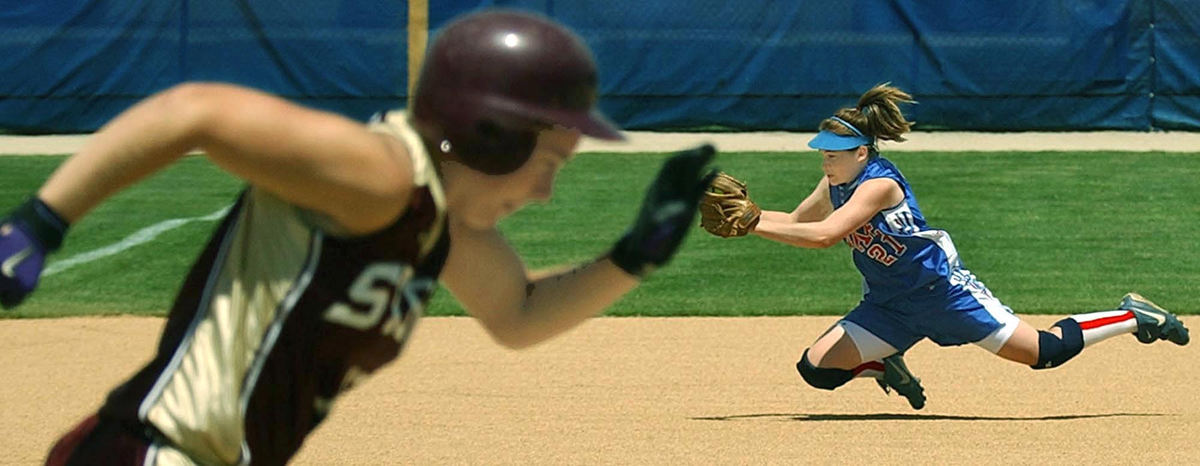Award of Excellence, Sports Action - Ed Suba Jr. / Akron Beacon JournalLake shortstop Megan Wright makes a diving catch of a line drive off the bat of Stow's Lisa Miller in a Division I regional championship game at Buchtel Field on, May 29, 2004 in Akron. 