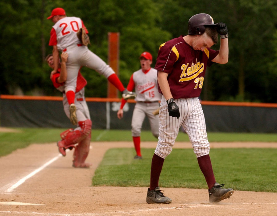 Award of Excellence, Sports Feature - David Distelhorst / Ohio UniversityCentral Catholic's Kevin Wammes leaps into a teammates arms after striking out Kalida's Brandon Brickner (right) to win the regional championship, 3-2, in eight innings.