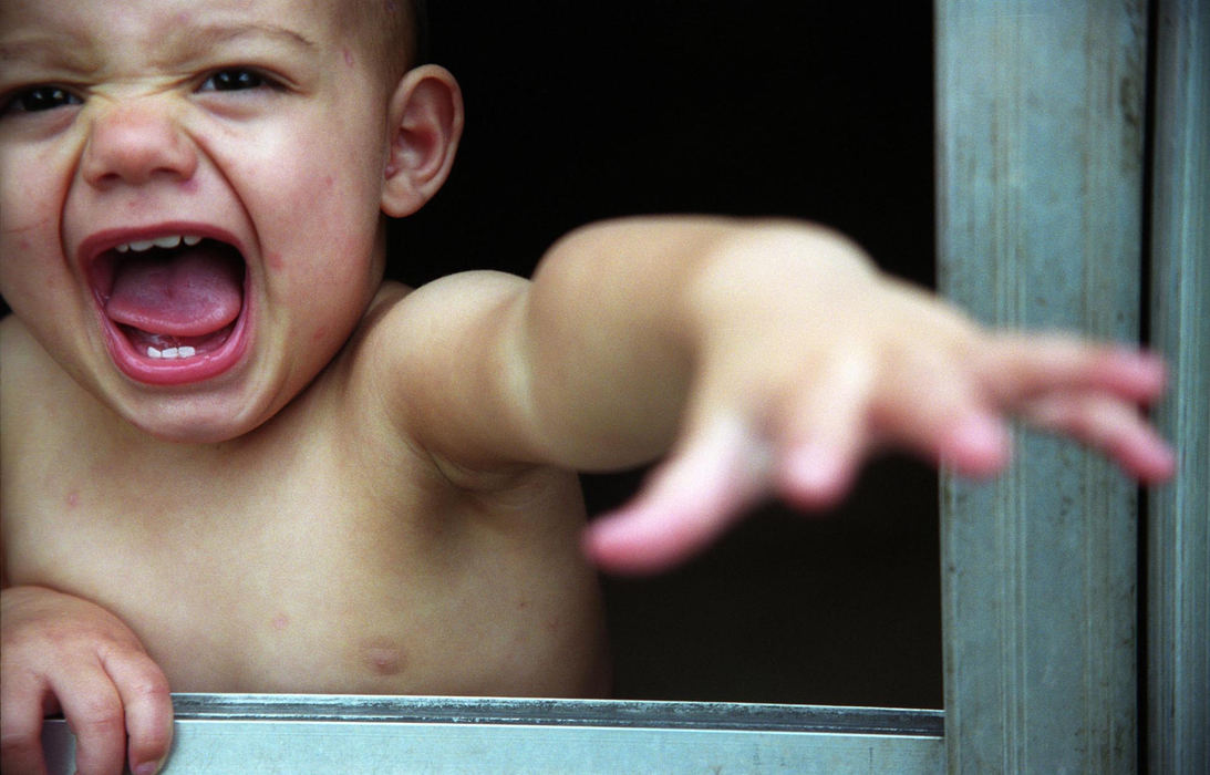 First Place, Student Photographer of the Year - Samantha Reinders / Ohio UniversityElijah has the chicken pox and is under his young sisters care while his parents are at work.