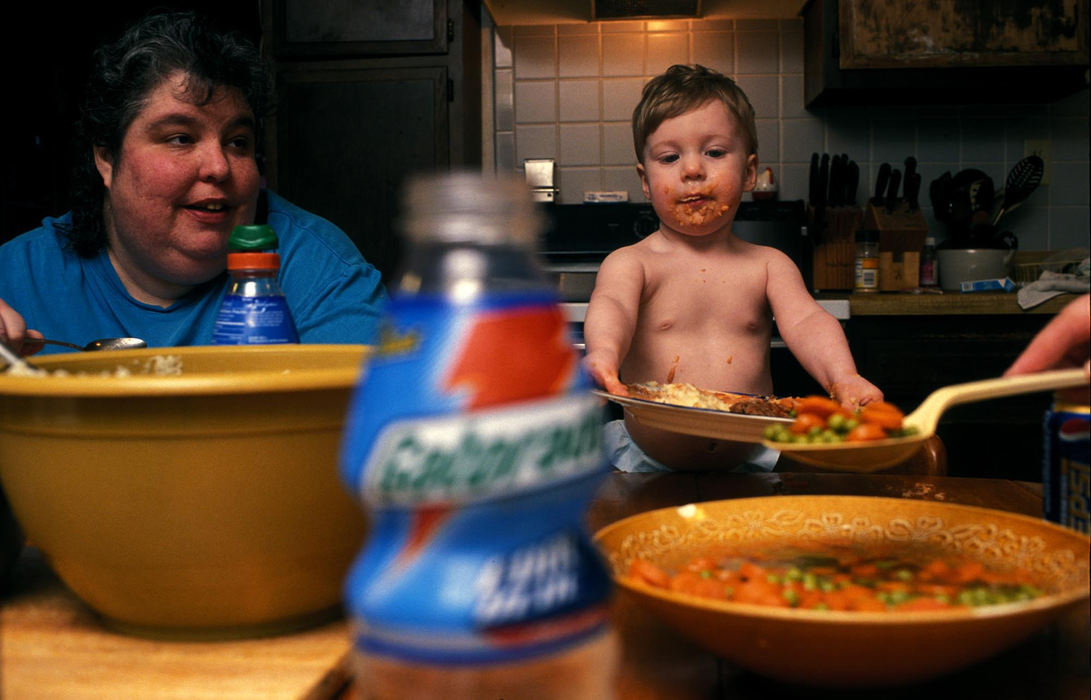 First Place, Student Photographer of the Year - Samantha Reinders / Ohio UniversityErin Jones demands more peas and carrots as his aunt and mother look on, oblivious to the nightly dinnertime melee that is in progress.