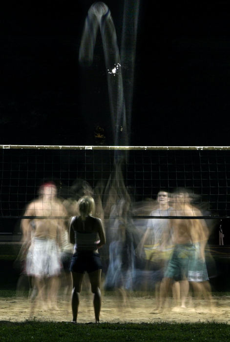 Second Place, Student Photographer of the Year - Michael P. King / Ohio UniversityKelly Busch, an Ohio University freshman from Brunswick waits to make a hit while playing a pickup game of volleyball with other residence hall residents near Nelson Commons on the Athens campus, September 13, 2004. The students from Brown, MacKinnon, Crawford, and Pickering Halls regularly meet on fall weeknights to play such pickup games.