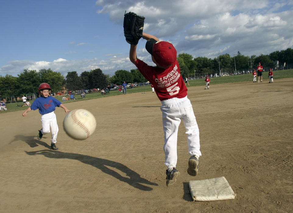 Second Place, Student Photographer of the Year - Michael P. King / Ohio UniversityThe Reds' Jacob Kuhn, 6, makes a leaping attempt to catch an incoming throw to first base, but misses, during a North Columbus Intramural League T-Ball game at Whetstone Park in the Clintonville neighborhood of Columbus, on July 14, 2004.