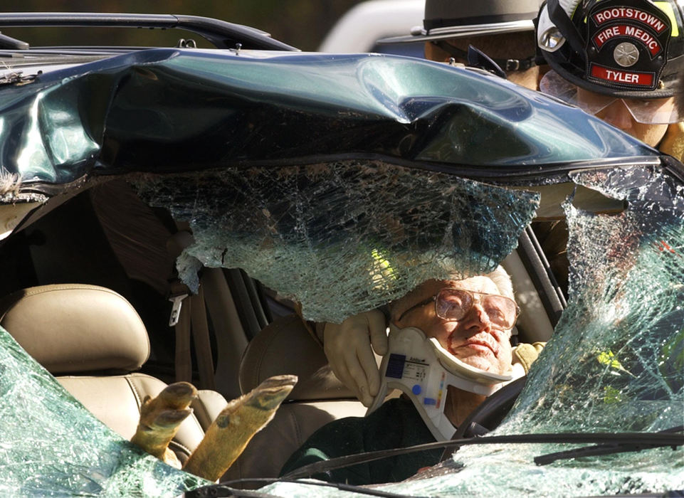 Third Place, Student Photographer of the Year - Haraz Ghanbari / Kent State UniversityA Rootstown Township fire medic treats an unidentified elderly man after a six-point buck crashed through the windshield of the van he was driving on Interstate 76, Oct. 24, 2004, in Brimfield Township. The collision killed the buck while causing a female passenger to suffer a head injury.