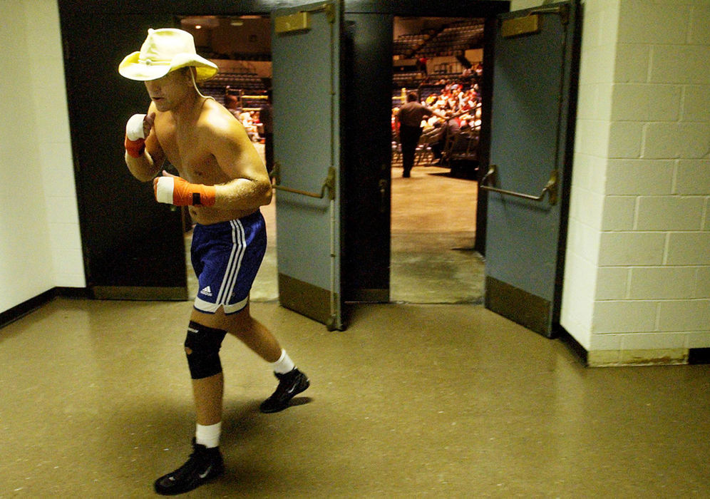 Third Place, Student Photographer of the Year - Haraz Ghanbari / Kent State UniversitySemi-truck driver Andy Lundy, 29, of Mobile, Ala., warms up before his fight in the Toughman Contest, July 9, 2004, in Dothan, Ala. Lundy, competing in the heavyweight division and known by the boxing name of the "Cowboy," wears a cowboy hat for good luck.