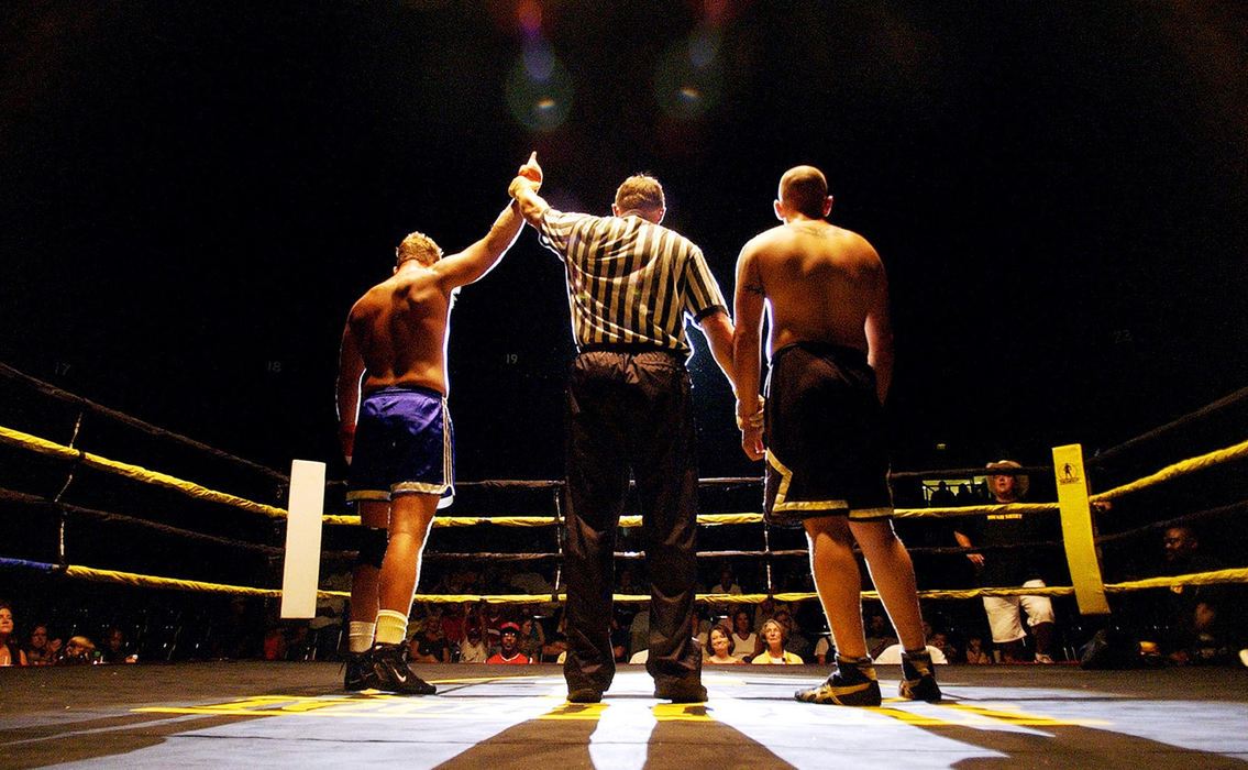 Third Place, Student Photographer of the Year - Haraz Ghanbari / Kent State UniversityBoxing referee John Cade holds up the arm of semi-truck driver Andy "Cowboy" Lundy after he defeated Army soldier Steven "Mad Dog" Drake, during a three-round match of the Toughman Contest, July 9, 2004, in Dothan, Ala. 