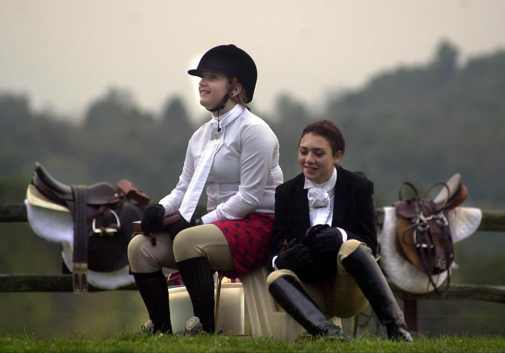 Second Place, Sports Picture Story - Andy Wrobel / Warren Tribune ChronicleYoung fox hunters Kaley Laurita (left) and Erika Demaio (right) wait in their outfits early one Saturday morning for the beginning of the the Gully Ridge Fox Hunt.