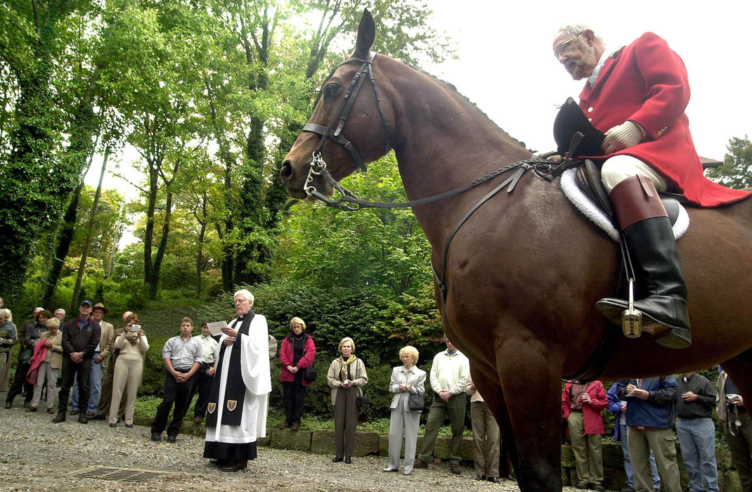 Second Place, Sports Picture Story - Andy Wrobel / Warren Tribune ChronicleRobert Hunkus sits on top of his mount as a priest blesses the riders and hounds before the fox hunt. Hunkus is the owner of the Gully Ridge Farm on which the Gully Ridge Hunt Club held its opening season hunt.