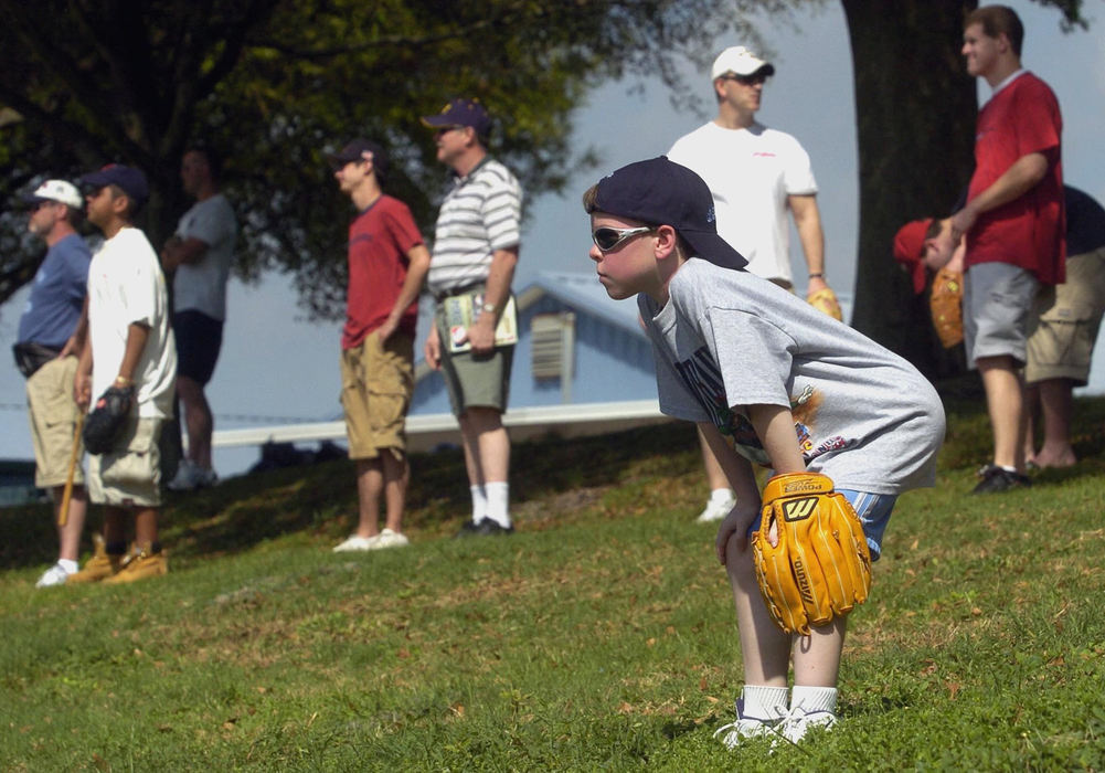 Third Place, Sports Picture Story - Chuck Crow / The Plain DealerWaiting outside the home run fence, a youngster waits for action, sunglasses and glove on, hat on backwards, and crouched like he was playing the outfield.