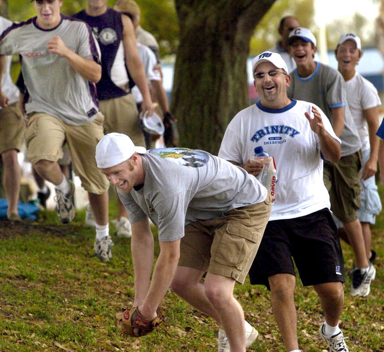 Third Place, Sports Picture Story - Chuck Crow / The Plain DealerWhether you are young or old, fun is had by all.  The quest to be the first to the baseball is a game in itself.