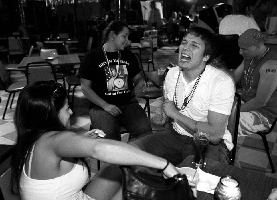 Award of Excellence, Sports Picture Story - Andy Morrison / The BladeVargas, with his amused girlfriend Megan, cuts loose in a local bar while hanging out with friends and family. 