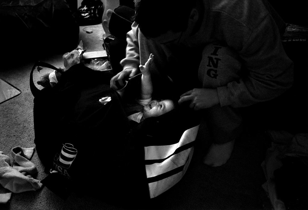 Award of Excellence, Sports Picture Story - Andy Morrison / The BladeVargas plays with his son Bishop as he packs to leave for a boxing tournament. 