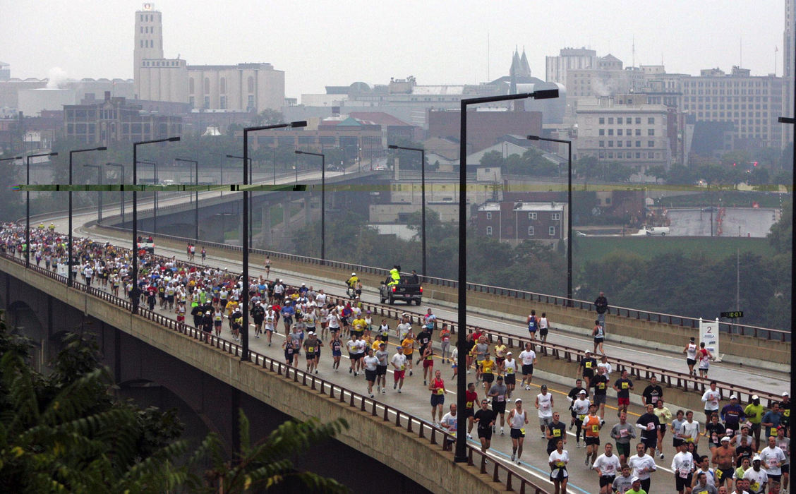 First Place, Team Picture Story - Lew Stamp / Akron Beacon JournalThe 2004 Road Runner Akron Marathon field remains tightly packed on the  northbound side of the All-American Bridge in the early going. The leaders are returning on the south bound side. 