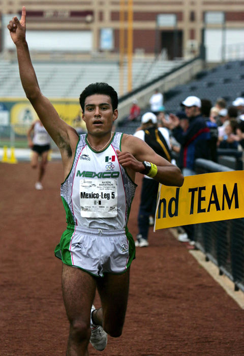 First Place, Team Picture Story - Ed Suba Jr. / Akron Beacon JournalTeam Mexico anchor Alejandro Suarez crossed the finish line at Canal Park four seconds ahead of the United States team to finish first in the relay at  the 2004 Road Runner Akron Marathon on October 2, 2004. 