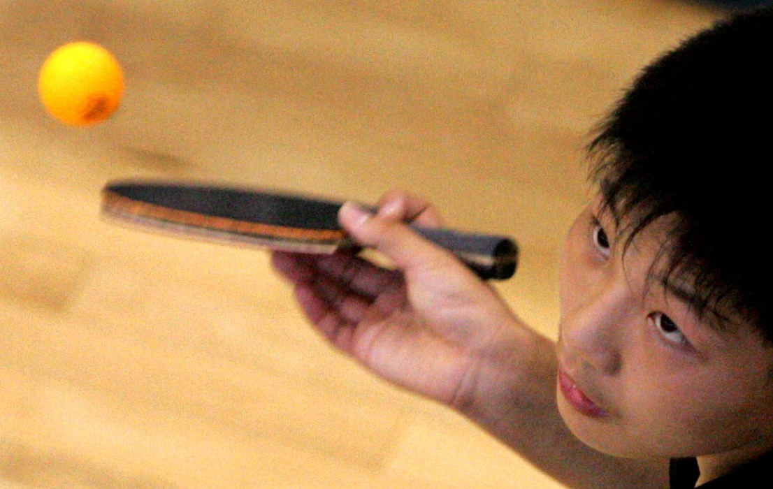 Second Place, Team Picture Story - Mike Levy / The Plain DealerZi Wang of Zhenjiana, China, concentrates during a table-tennis match.  