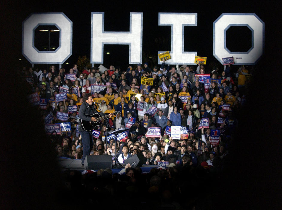 Third Place, Team Picture Story - Scott Shaw / The Plain DealerThe conventional wisdom in the 2004 presidential campaign was the candidate who wins Ohio wins the White House.  Both candidates waged a fierce battle for Ohio, making dozens of trips to the state in the hopes of bringing home a victory. Bruce Springsteen warms up the crowd in Cleveland before John Kerry appeared in a last-minute appeal for votes.  