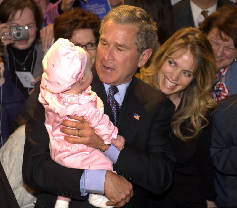 Third Place, Team Picture Story - Scott Shaw / The Plain DealerPresident Bush holds 3-month-old Brooke Lee as her mother, Nicole, beams.