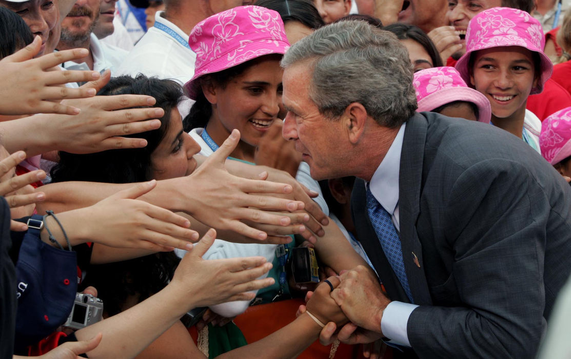 Third Place, Team Picture Story - John Kuntz / The Plain DealerPresident Bush greets members and officials of the girls soccer team from Afghanistan at the International Children's Games in Cleveland.