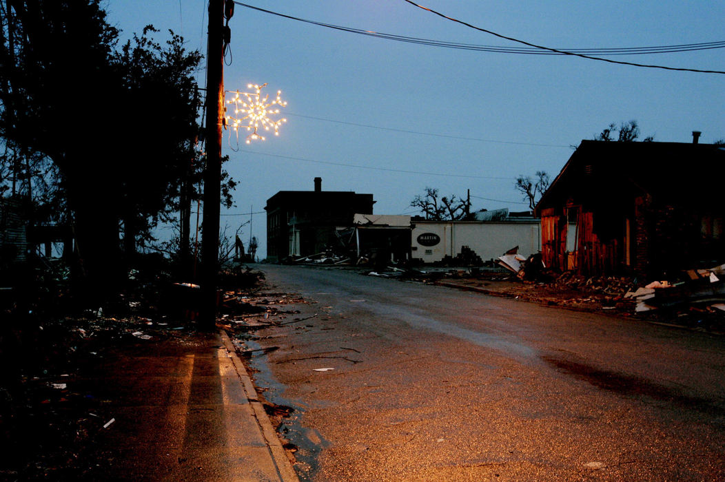 Award of Excellence, Assigned Feature - Eric Albrecht / The Columbus DispatchDespite the rain brought on by Hurricane Katrina citizens of Pass Christian Ms. managed to hang  one lit Christmas decoration downtown .