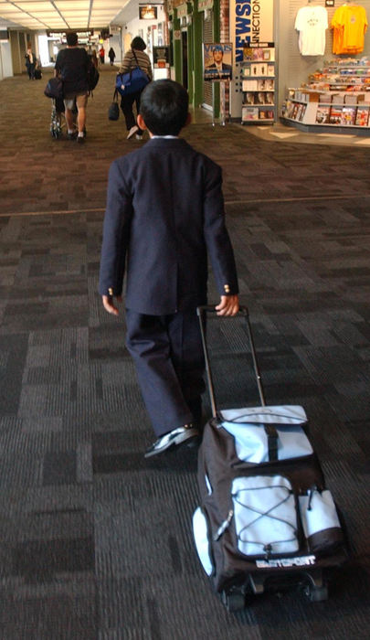 Second Place, Feature Picture Story - Karen Schiey / Akron Beacon JournalMajid heads to his gate at Hopkins International Airport in Cleveland before boarding a plane to Jordan where he will meet his father.