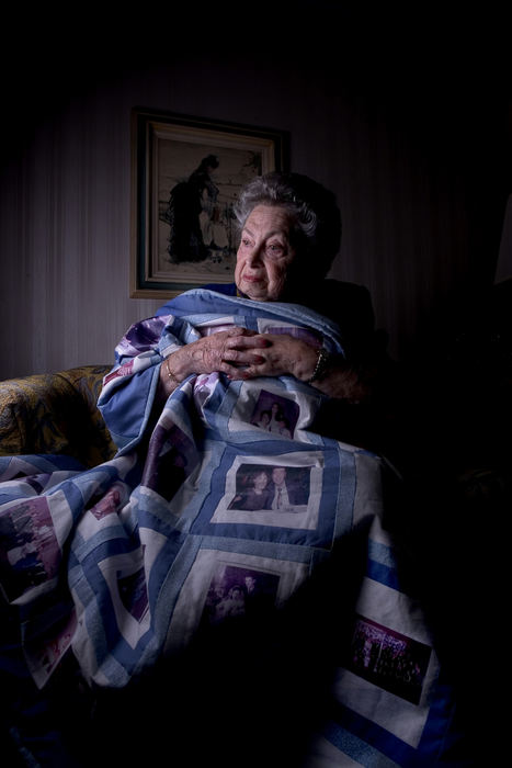 First Place, Feature Picture Story - Mike Levy / The Plain DealerSylvia Malcmacher holocaust survivor with her quilt that contains family photo images.