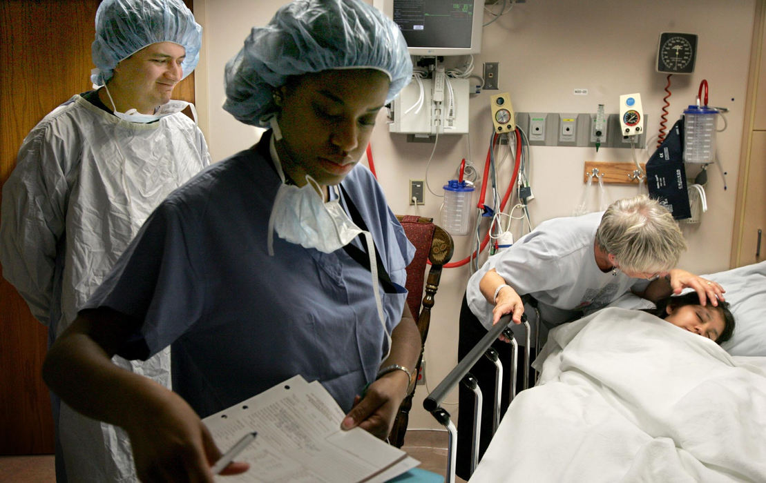 Award of Excellence, Feature Picture Story - David I. Andersen / The Plain DealerGuido smiles as Dianne Smarrella, the woman Heidi calls grandma, comforts her before she is wheeled off to surgery.