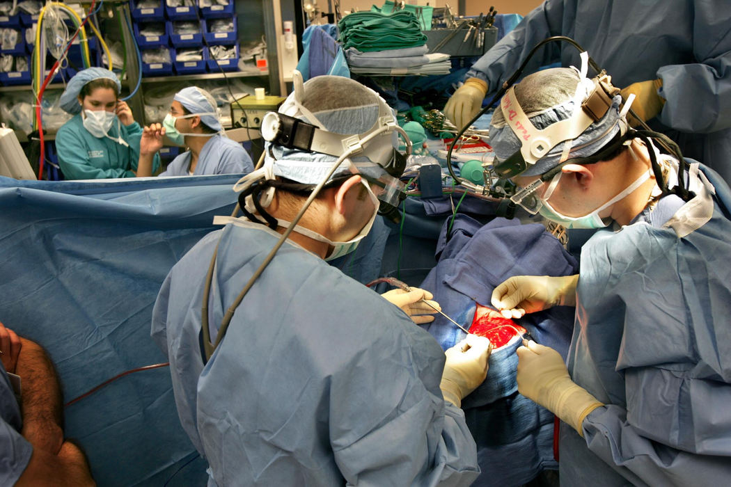 Award of Excellence, Feature Picture Story - David I. Andersen / The Plain DealerCleveland Clinic surgeons Ali Chahlavi (left) and Fortino Salazar expose Heidi’s brain as they prepare to disconnect the left side of her brain. 