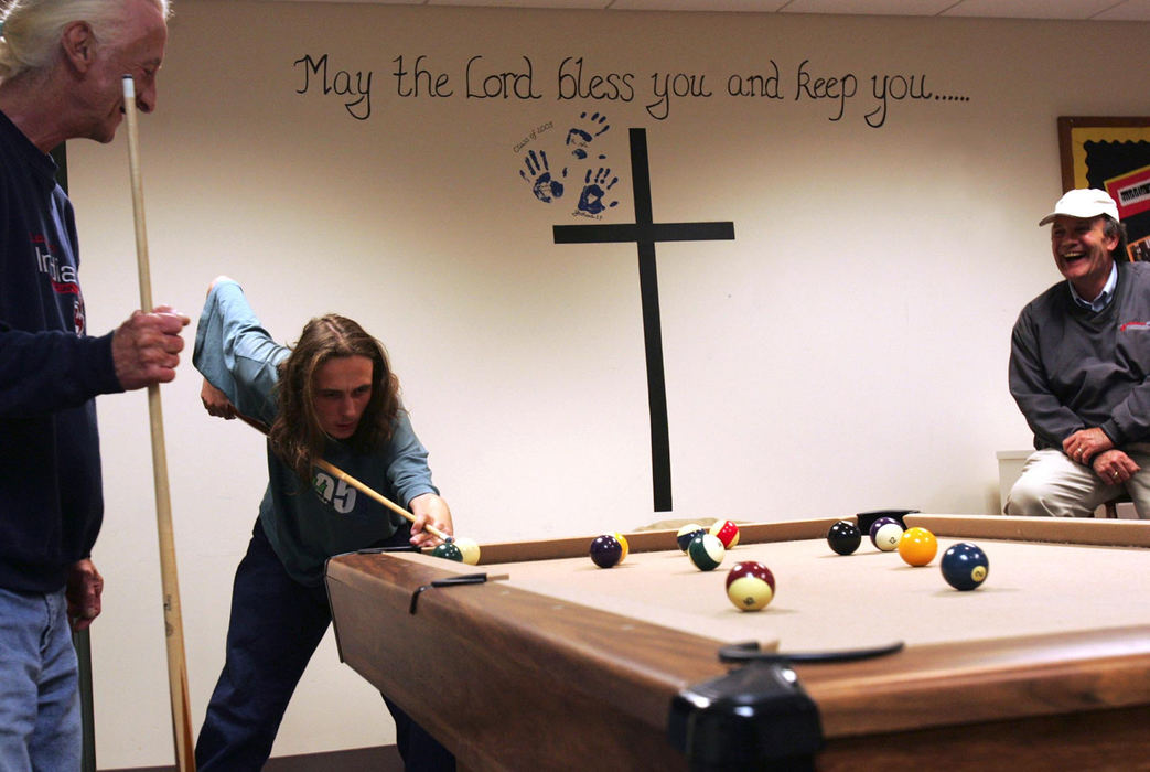 Award of Excellence, Feature Picture Story - Emily Rasisnki / Kent State UniversityJoseph and Joey play pool at the First Congregational Church in Hudson while volunteer Rick Knapper keeps them company.  The volunteers hang out with the families during the evening until lights-out at 11 p.m.