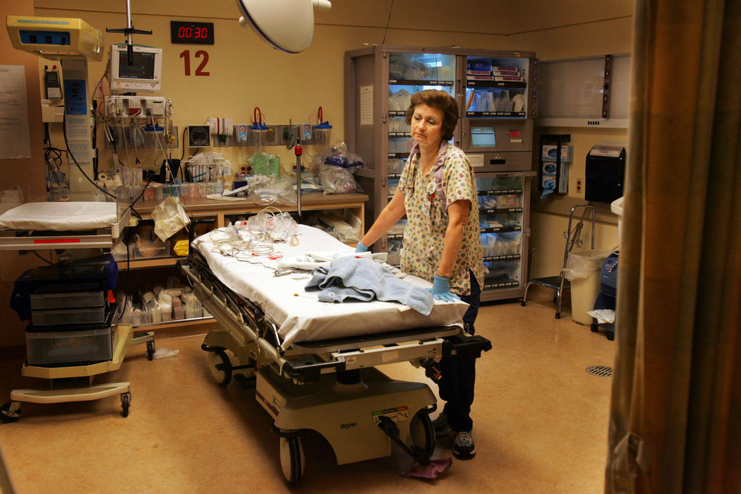 Award of Excellence, Feature Picture Story - Gus Chan / The Plain DealerAn emergency room nurse tries to compose her self after tending to a newborn.