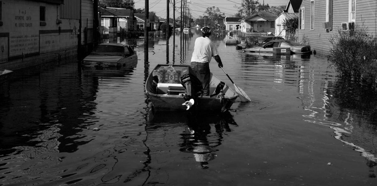 First place, News Picture Story - Dale Omori / The Plain DealerA man rows a boat down a flooded street in Arabi, a section of New Orleans, La., in the aftermath of Hurricane Katrina.
