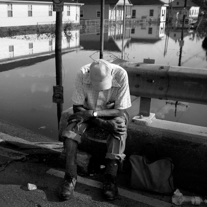 First place, News Picture Story - Dale Omori / The Plain DealerJames Cooper, 91, sits on the St. Claude Ave. Bridge after being rescued from the flooded out Arab section of New Orleans, Sept. 4, 2005.