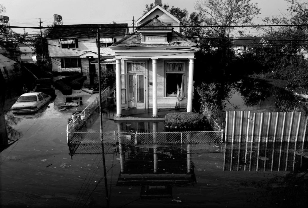 First place, News Picture Story - Dale Omori / The Plain DealerHomes are surrounded by flood waters in New Orleans in the aftermath of Hurricane Katrina.                                
