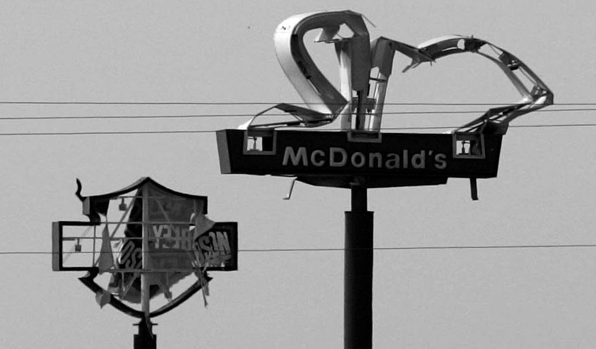 Award of Excellence, News Picture Story - Jpshua Gunter / The Plain DealerSigns that managed to stand through the battering winds of Hurricane Katrina were badly damaged. A Harley Davidson and McDonald's sign near Gulfport Mississippi, are barely recognizable, September 06, 2005.   