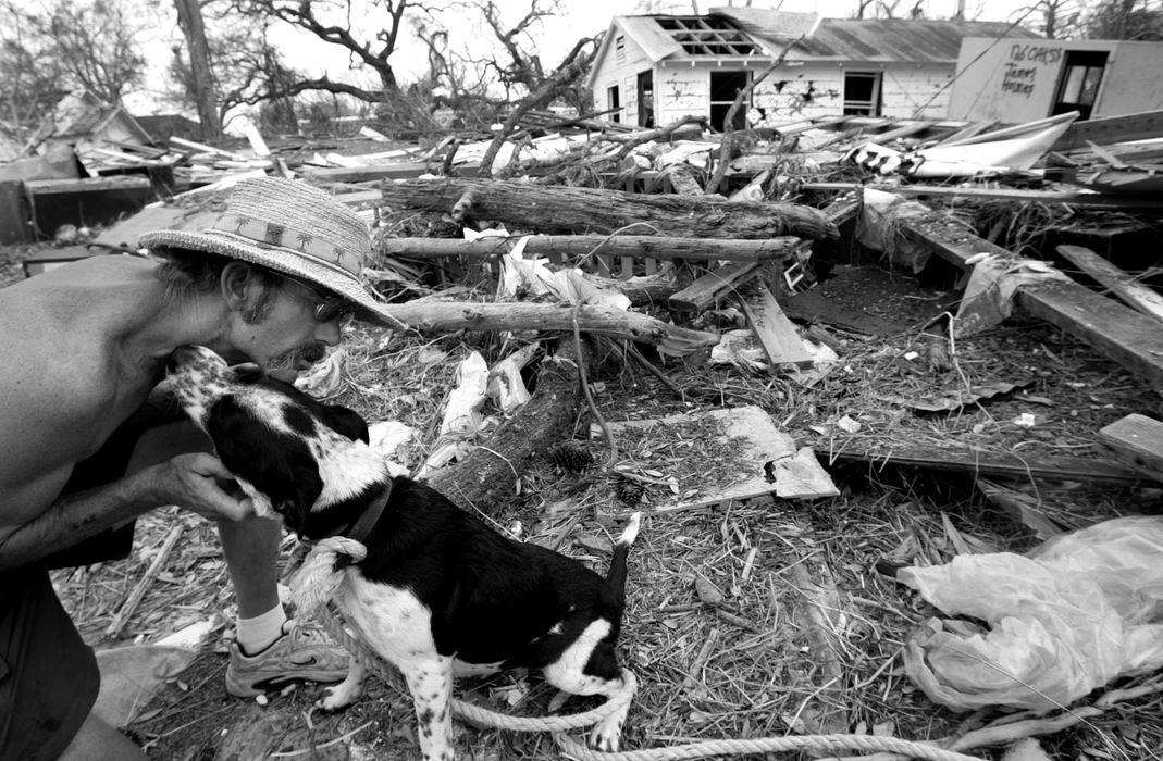 Award of Excellence, News Picture Story - Jpshua Gunter / The Plain DealerJoseph Brooks,41,  cares for Two Bit, a dog he rescued during hurricane Katrina, a stones throw from the ocean behind the Grand Casino in Biloxi, Mississippi, September 05, 2005. 