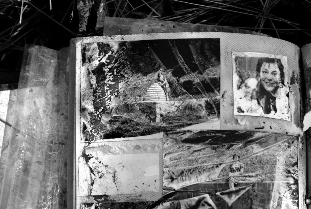 Award of Excellence, News Picture Story - Jpshua Gunter / The Plain DealerPersonal items are scattered across the roadside, mud-covered and water-stained. A photo album sits roadside in Pas Christian, Mississippi, September 03, 2005. 