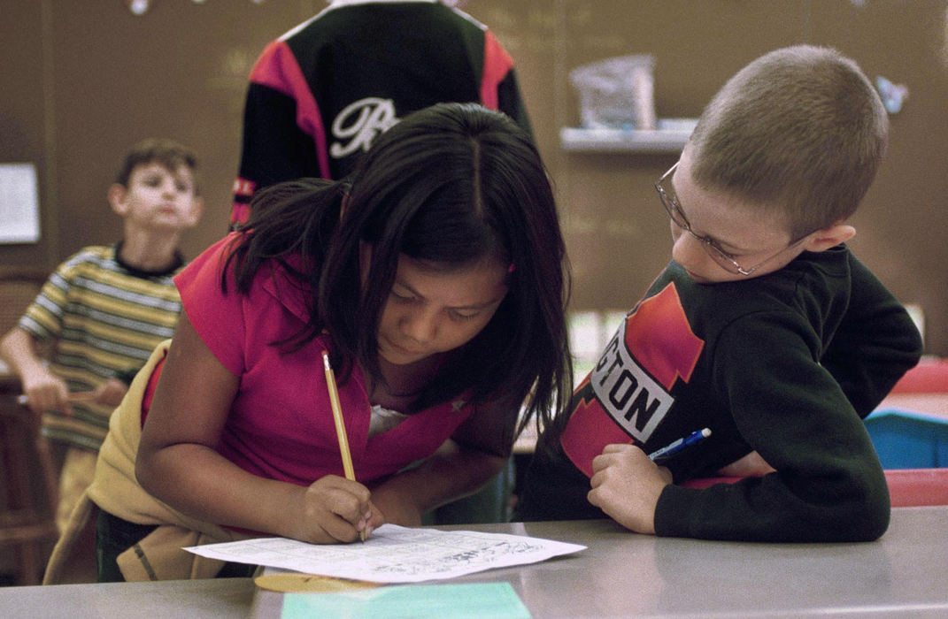 First place, James R. Gordon Ohio Understanding Award - Gary Harwood / Kent State UniversityAtalya Garcia is asked by a classmate if she attended a different school last year as children get to know each other during a get acquainted exercise on the first day of school at Marlboro Elementary School near Alliance, Ohio. Attending different schools is a common experience for migrant children.