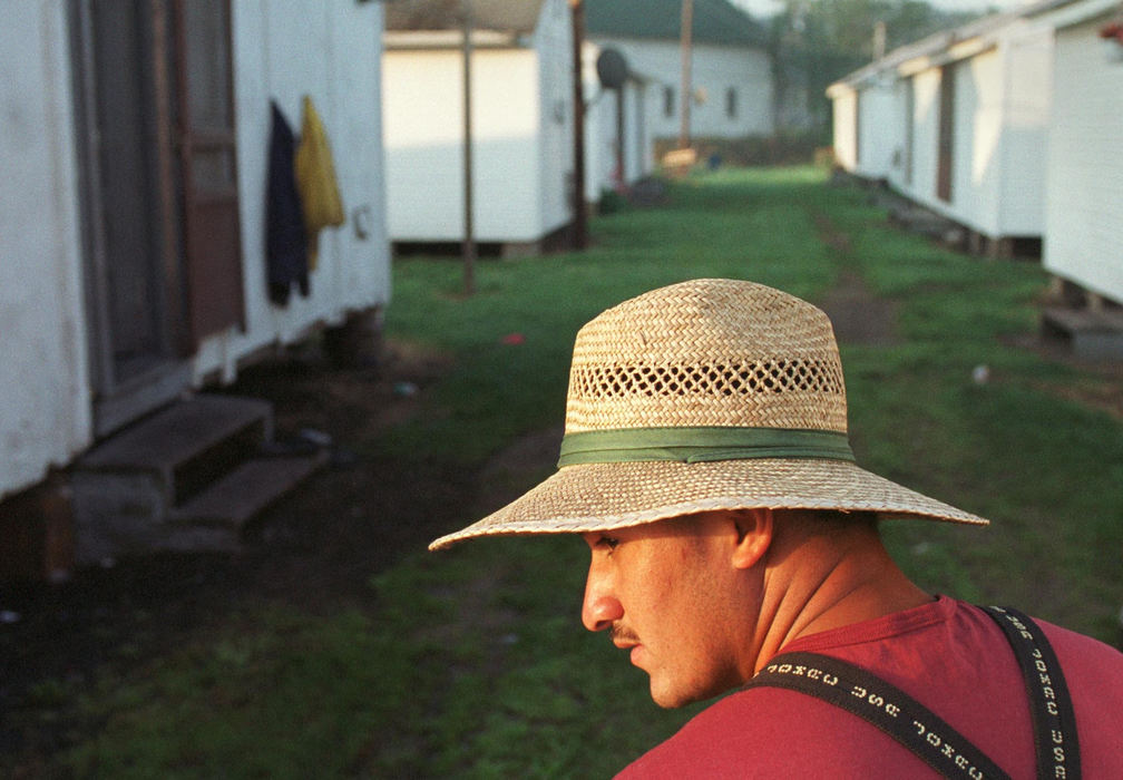 First place, James R. Gordon Ohio Understanding Award - Gary Harwood / Kent State UniversityRuben Balderas looks toward the fields at sunrise while waiting for the work bus to take him to the fields. The foreman for each crew travels to the camps to gather the workers before stopping at the washhouse for supplies and their harvest orders.