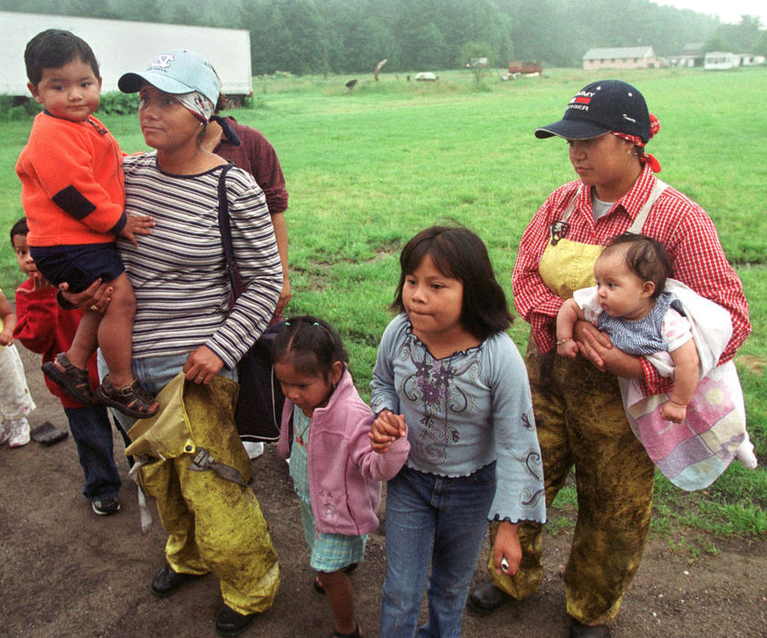 First place, James R. Gordon Ohio Understanding Award - Gary Harwood / Kent State UniversityMigrant women wait for the daycare bus to collect their children before their work vans take them into the fields. Daycare is provided in Hartville by the Texas Migrant Head Start program. The availability of quality daycare allows more families to become established in Hartville.
