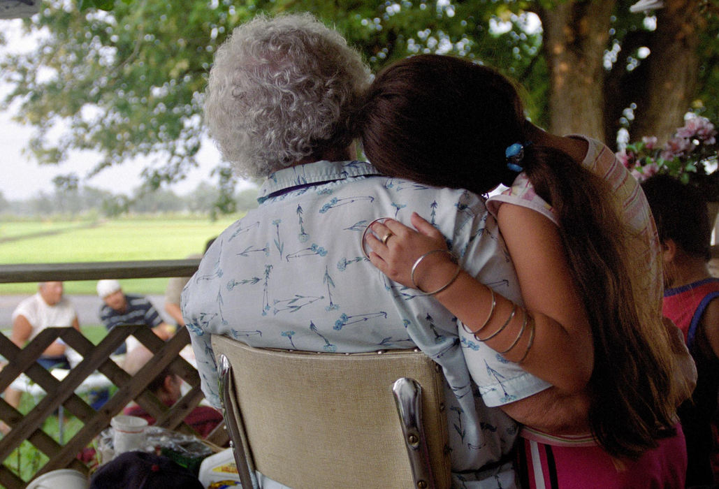 First place, James R. Gordon Ohio Understanding Award - Gary Harwood / Kent State UniversityOn the front porch of her home, May Nichols, who lives across the street from the Soto family, shares an affectionate moment with Brianna Soto. May considers Brianna her “Mexican granddaughter.” Over the years, the members of the migrant community have bonded with members of the Hartville community.