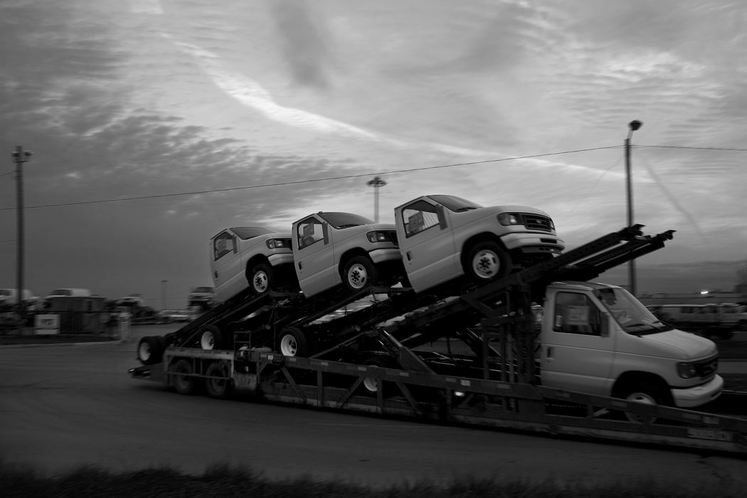 Second Place, James R. Gordon Ohio Understanding Award - Mike Levy / The Plain DealerOne of the last loads of Ford Econoline trucks leaves the Lorain Assembly Plant days before the plant closed.