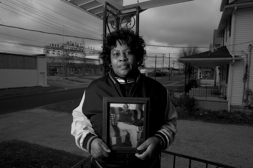 Second Place, James R. Gordon Ohio Understanding Award - Mike Levy / The Plain DealerMary Ann McGee who has reitred from Ford holds a picture of her son who will lose his job in Lorain when the Lorain Assembly Plant closes.