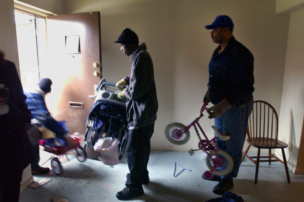 Third Place, George S. Smallsreed Photographer of the Year Award - Gus Chan / The Plain DealerIt took all of five minutes for movers to clean out an apartment of a mother of two in a housing project off E. 55th St.