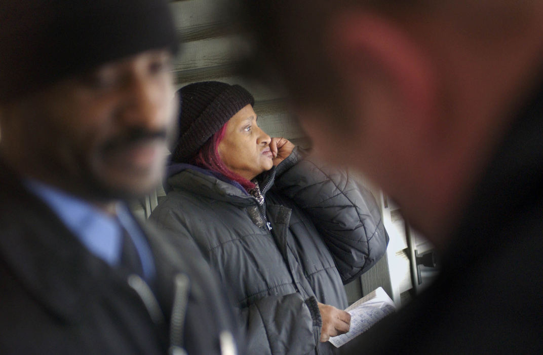 Third Place, George S. Smallsreed Photographer of the Year Award - Gus Chan / The Plain DealerCheryl Wiley frantically phones friends and family searching for someone to help her mover her belongings from the yard.